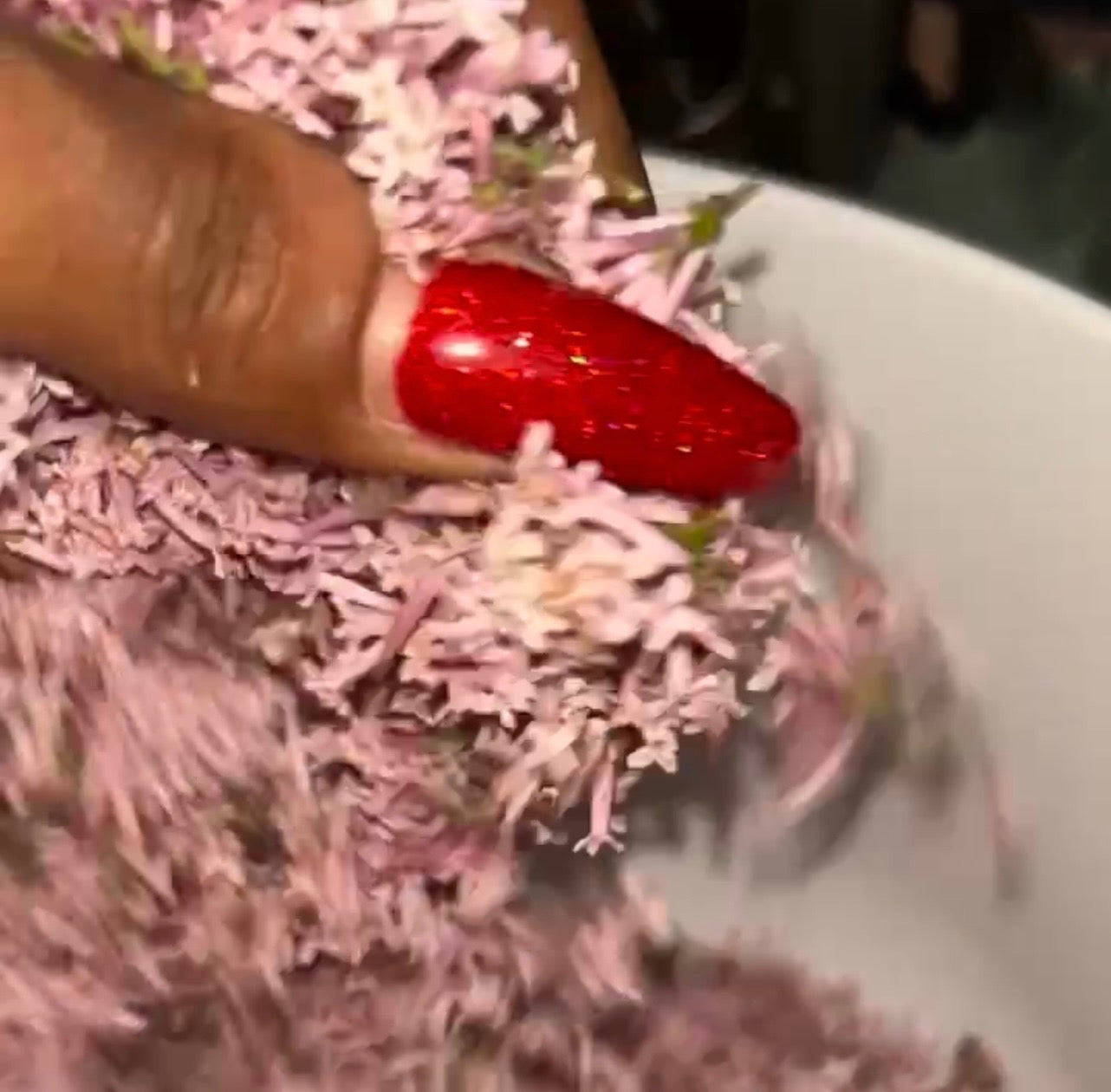 Fresh lilac blossoms being processed by hand for Glamtique Studio Soft Girl spiritual bath.